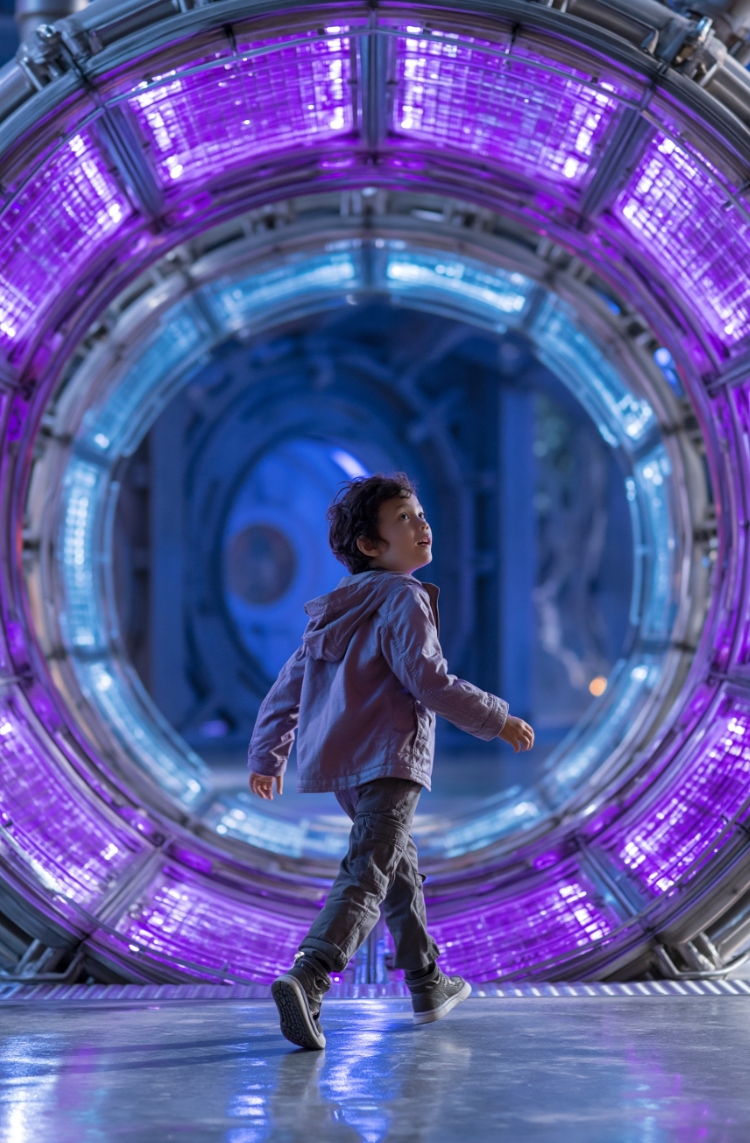 Young passenger in the low-gravity dome under the constellation ceiling